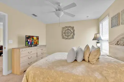 a bedroom with a bed with a television and a dresser at MYR1466 in Philadelphia