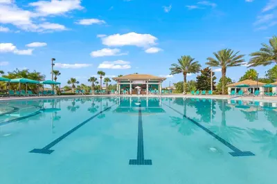 a large swimming pool at a resort with palm trees at MYR1471 in Philadelphia