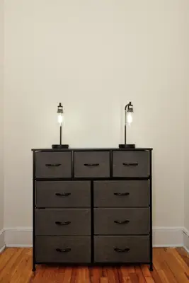 a dresser with two lamps on top of it at Prime Murray Hill 1BR - Near Grand Central in New York