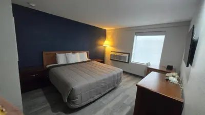 a hotel room with a bed and a window at Roosevelt Inn at Roosevelt Blvd, Philadelphia, PA in Philadelphia