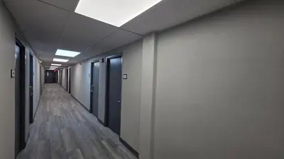 an empty corridor of an office building with a hallway at Roosevelt Inn at Roosevelt Blvd, Philadelphia, PA in Philadelphia