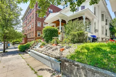 a house with a garden in front of it at Historic Home with Yard in the Heart of Reading! in Reading