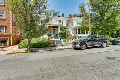 a truck parked in front of a house at Historic Home with Yard in the Heart of Reading! in Reading