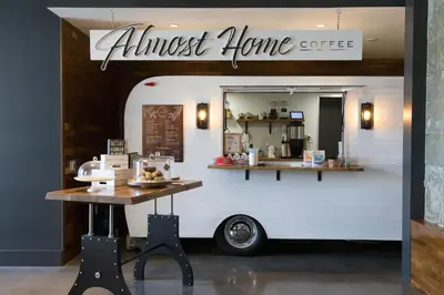an almost home coffee truck with a table in front of it at Chique Loft 10 Min from NYC with Gym, Pool & Sauna in Jersey City