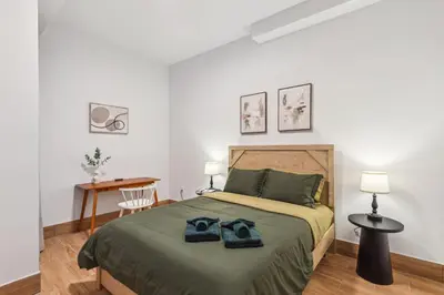 a bedroom with a bed with two shoes on it at Stay at Luna on 800 Callowhill in Philadelphia