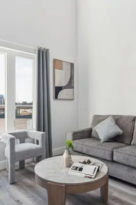 a living room with a couch and a coffee table at Stay at Luna on 800 Callowhill in Philadelphia