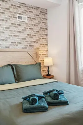 a bedroom with a bed with towels on it at Stay at Luna on 800 Callowhill in Philadelphia