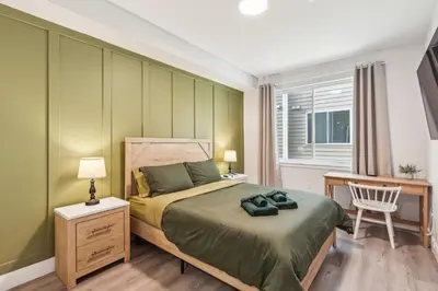 a bedroom with a bed and a desk and a chair at Stay at Luna on 800 Callowhill in Philadelphia