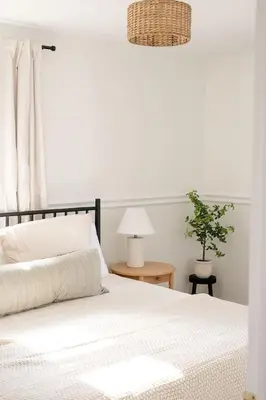 a bedroom with a white bed and a potted plant at Wooded Cottage in Elizabethtown with hot tub and sauna in Elizabethtown