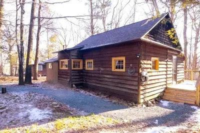 a small wooden cabin in the woods at Rustic Retreat Fireplace, Casino, Camelback Close to everything! in Mount Pocono