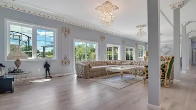 a living room with a couch and a table at VIP Mansion Estate in Blakeslee