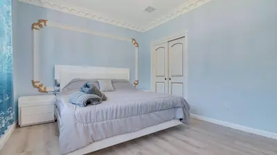 a bedroom with a bed with a teddy bear on it at VIP Mansion Estate in Blakeslee