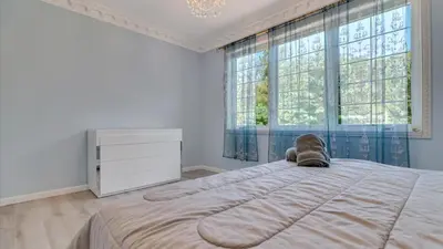 a bedroom with a large bed and a dresser at VIP Mansion Estate in Blakeslee