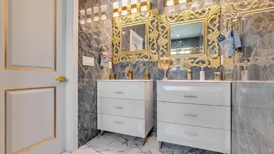 a bathroom with a white dresser and a mirror at VIP Mansion Estate in Blakeslee