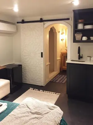 a room with a closet with a door in it at JC Moroccan Hideaway in Jersey City