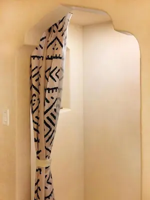 a black and white curtain hanging in a room at JC Moroccan Hideaway in Jersey City