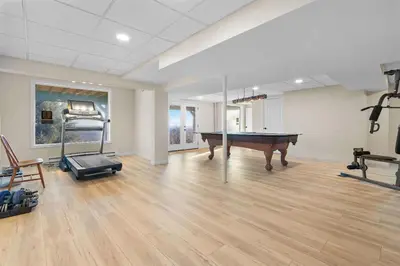 an empty room with a pool table and a treadmill at Hidden Gem Best Views Unbeatable Seclusion etc in Albrightsville