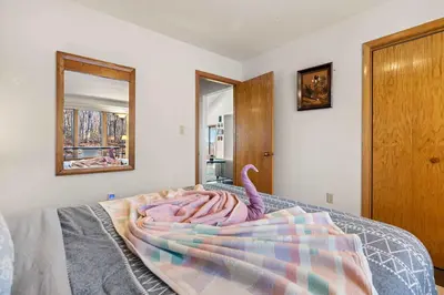 a bedroom with a bed with a blanket on it at Hidden Gem Best Views Unbeatable Seclusion etc in Albrightsville