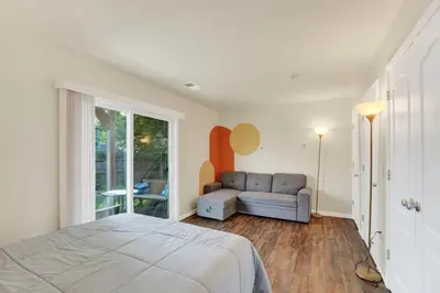 a bedroom with a bed and a couch at Chic Modern Townhouse 4BR 4B in Wilmington