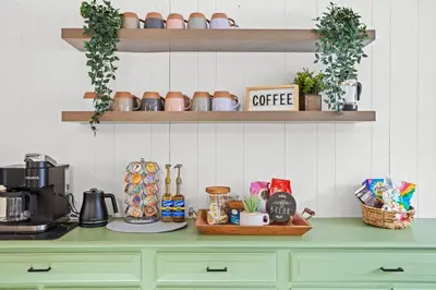 a kitchen counter with a green counter top with a coffee maker at Pocono Retreat Hot Tub MovieRoom GameRoom etc in Lake Harmony