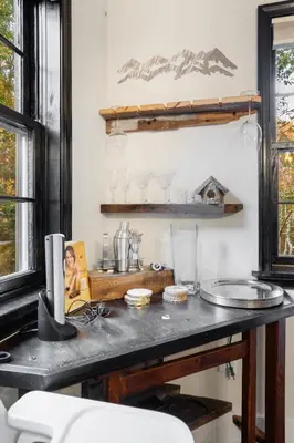 a kitchen with a table with a counter top at Serene Whitetail Retreat Entertainment Galore in Long Pond
