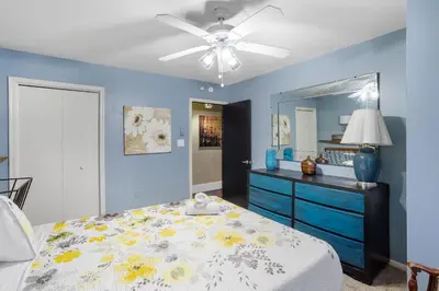 a bedroom with a bed and a dresser with a mirror at Serene Whitetail Retreat Entertainment Galore in Long Pond