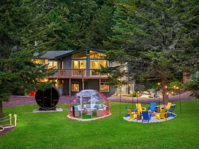 a house with a yard with chairs and a gazebo at The Lazy Bear Cabin Dome Hot Tub Sauna & More in Albrightsville