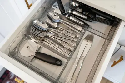 a drawer full of utensils in a drawer at The Lazy Bear Cabin Dome Hot Tub Sauna & More in Albrightsville