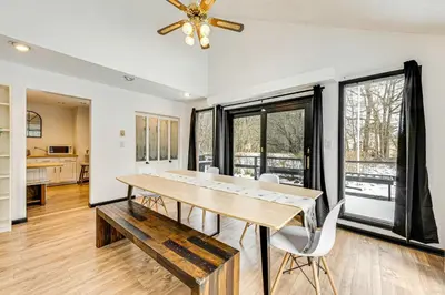 a dining room with a table and chairs at Hot Tub and Game Room Long Pond Getaway! in Long Pond