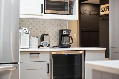 a kitchen with a microwave and a coffee maker at NewReno 8BR 6BTH DECK GAMES PETS in Lake Harmony
