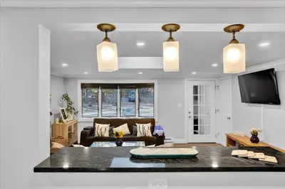 a living room with a couch and a table at Serene Pocono Escape Hot Tub Lake Access in Albrightsville