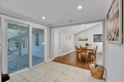 a kitchen and dining room with a sliding glass door at Serene Pocono Escape Hot Tub Lake Access in Albrightsville