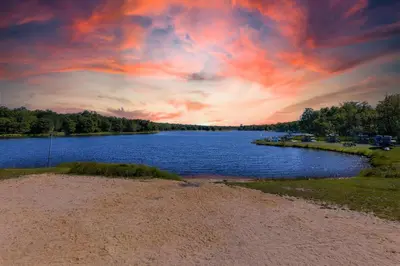 a view of a lake with a cloudy sky at Serene Pocono Escape Hot Tub Lake Access in Albrightsville
