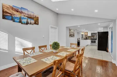 a kitchen and dining room with a table and chairs at Serene Pocono Escape Hot Tub Lake Access in Albrightsville