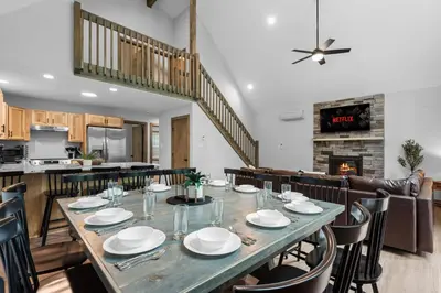 a large dining room with a table and chairs at Twin Chalet 6 BDs Hot Tub Game Area and more in Albrightsville