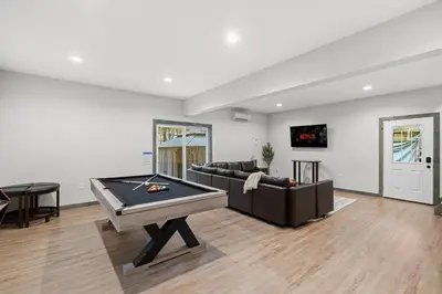 a living room with a ping pong table in it at Twin Chalet - 6 BDs Hot Tub Game Area and more in Albrightsville