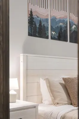 a bedroom with a white bed with three pictures on the wall at Twin Chalet - 6 BDs Hot Tub Game Area and more in Albrightsville