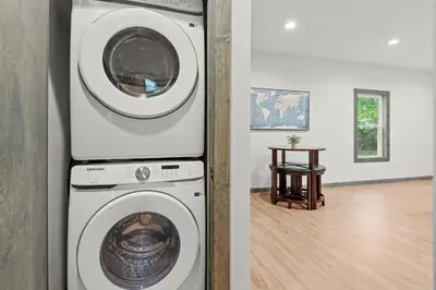 a washing machine and a dryer in a room at Twin Chalet - 6 BDs Hot Tub Game Area and more in Albrightsville