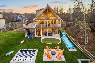 an aerial view of a house with a pool at Lakefront Movie & Game Rooms Hot Tub Sauna etc in Albrightsville