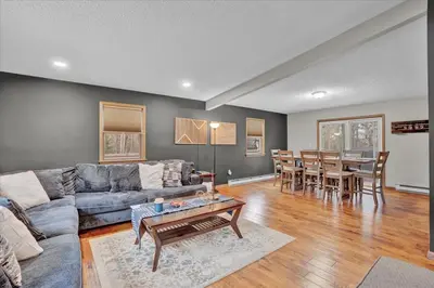 a living room with a couch and a table at Mountain Holidays-Sleeps 18 Firepit Bar & Gameroom in Lake Harmony