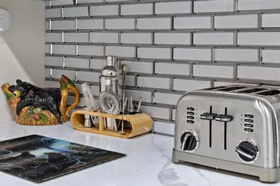 a toaster sitting on top of a kitchen counter at The Cozy Cubhouse Perfect Couples Getaway in Thornhurst