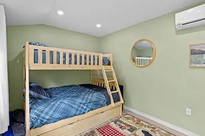 a bedroom with a bunk bed and a mirror at The Cozy Cubhouse Perfect Couples Getaway in Thornhurst