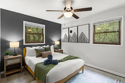 a bedroom with a bed and a ceiling fan at Cabin in the Skye - 5 BDs Lake Harmony in Lake Harmony