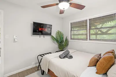 a bedroom with a bed and a ceiling fan at Cabin in the Skye - 5 BDs Lake Harmony in Lake Harmony