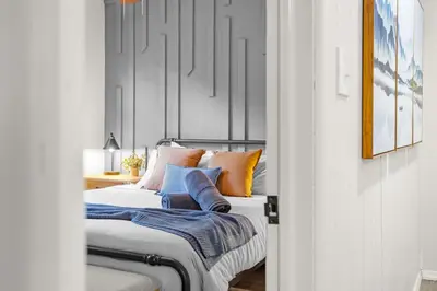 a bedroom with a bed with pillows on it at Cabin in the Skye - 5 BDs Lake Harmony in Lake Harmony