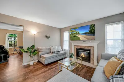 a living room with a couch and a fireplace at Spacious Retreat - Outdoor Oasis Games and more in Blakeslee