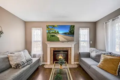 a living room with two couches and a fireplace at Spacious Retreat - Outdoor Oasis Games and more in Blakeslee