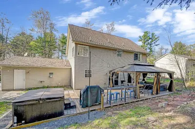 a house with a gazebo in front of it at Spacious Retreat - Outdoor Oasis Games and more in Blakeslee