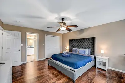 a bedroom with a bed and a ceiling fan at Spacious Retreat - Outdoor Oasis Games and more in Blakeslee