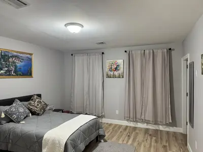 a bedroom with a bed and a window at Luxury Modern Apt near NYC for 4 people in Jersey City